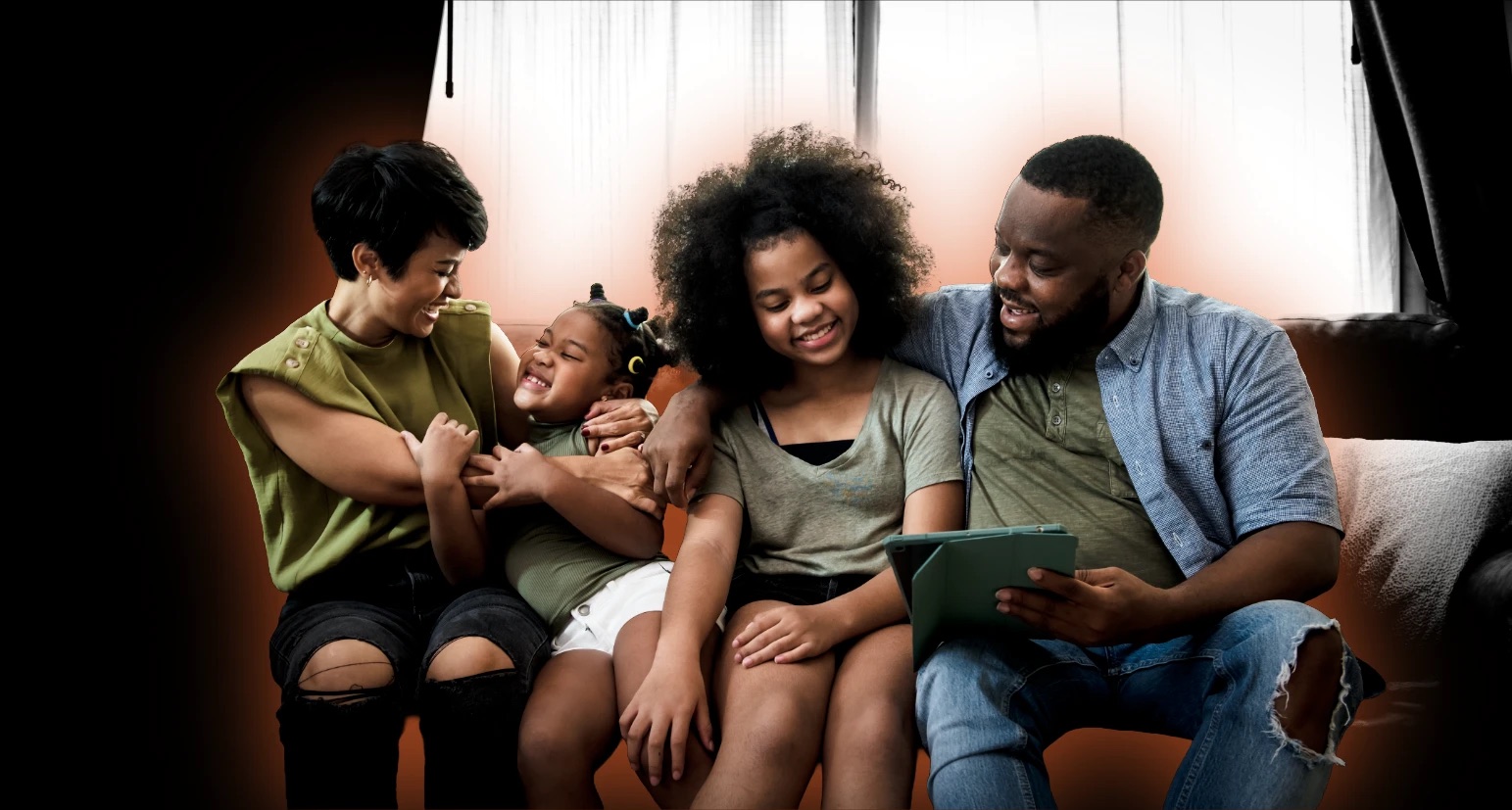 A family sitting together on the couch, sharing a calm moment