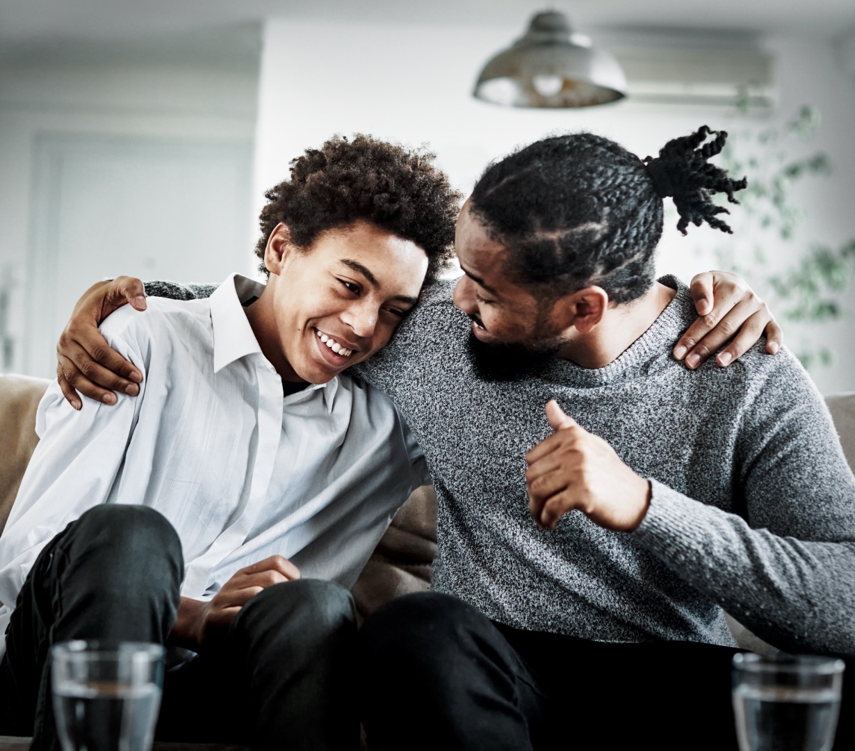 A father and teenage son sharing an encouraging, supportive moment